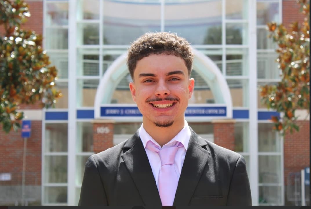 Professional headshot of John Cotelo